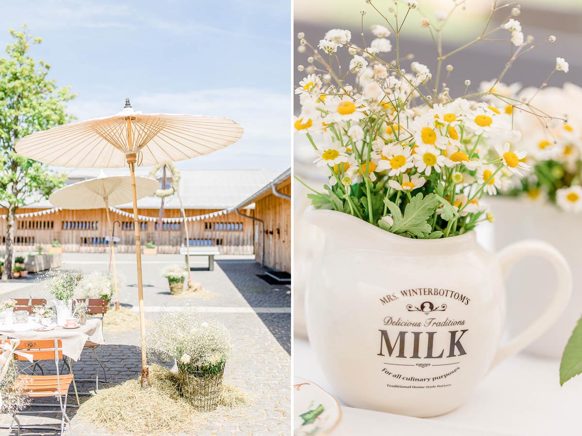 Milchkanne mit Wiesenblumen als Deko bei der Hochzeit auf der Alm