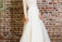 Brautkleid Champagner mit markanter Spitze, transparentem Langarm & weitem Tüllrock – Alexa